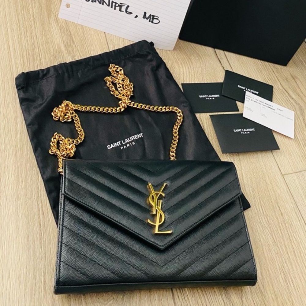 AUTHENTIC YSL purse with gold chain. 
Colour black Excellent condition!